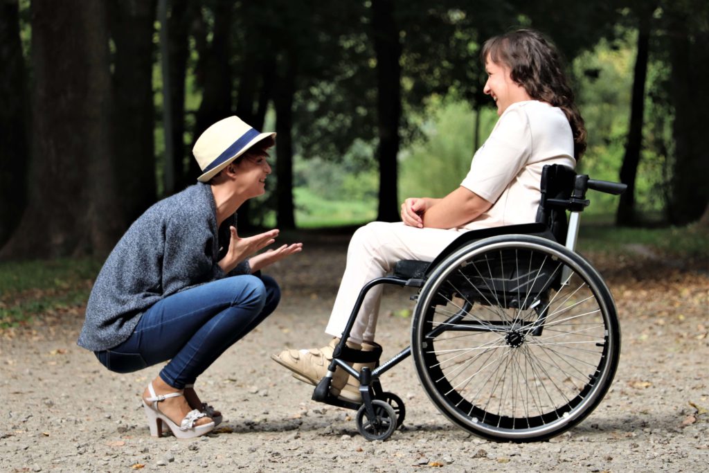 Disabled person next to friend