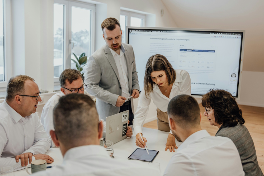 a team meeting with a digital whiteboard