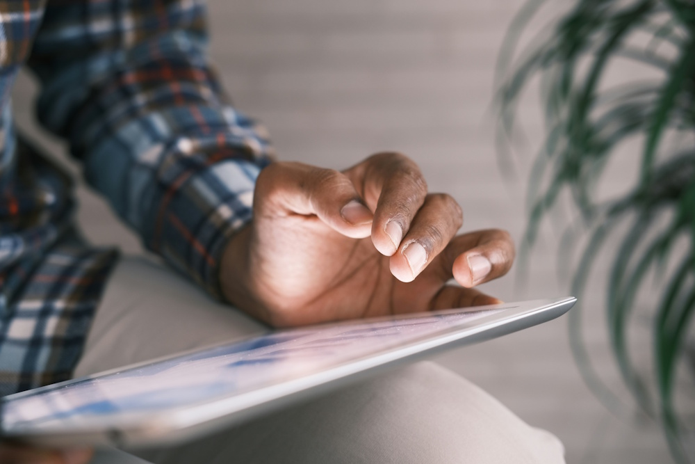 man reading on a tablet