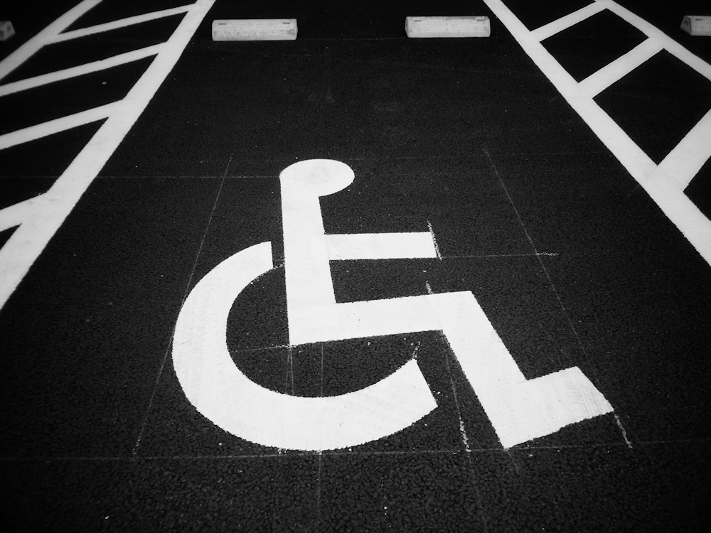 wheelchair sign painted onto a parking space