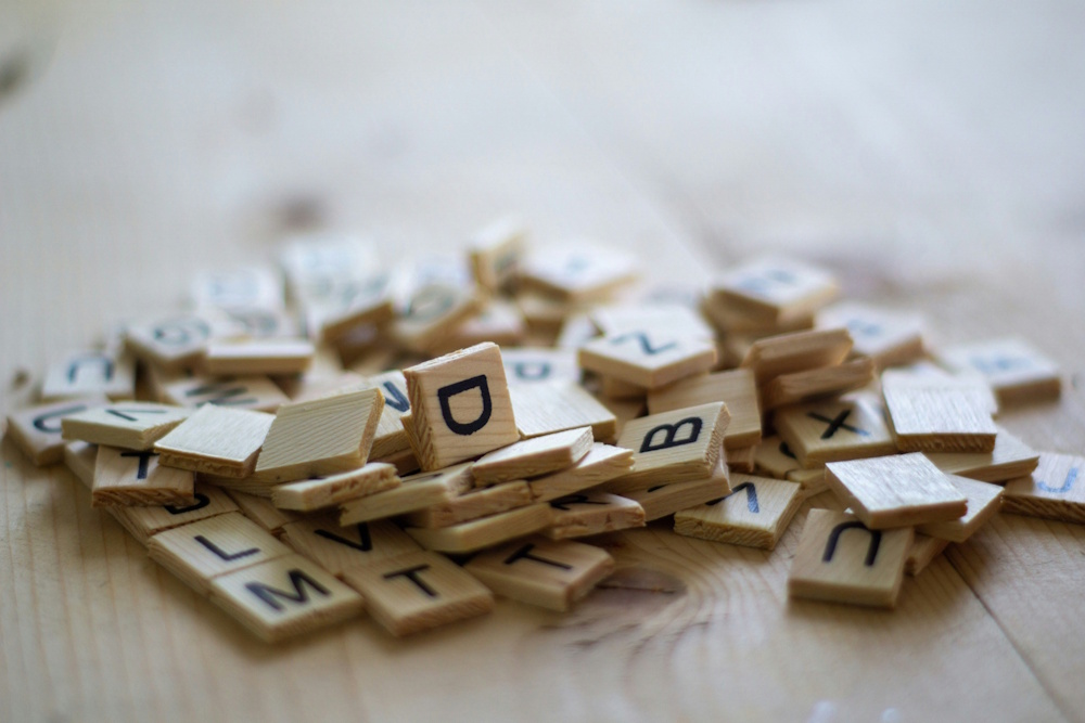 a collection of wooden scrabble pieces