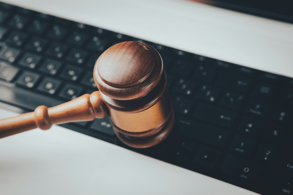 a gavel over a keyboard