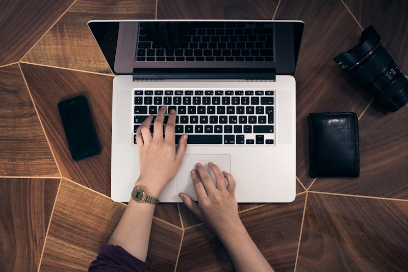 woman typing on a laptop keyboard